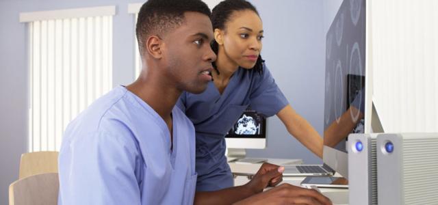 Nurses viewing a computer